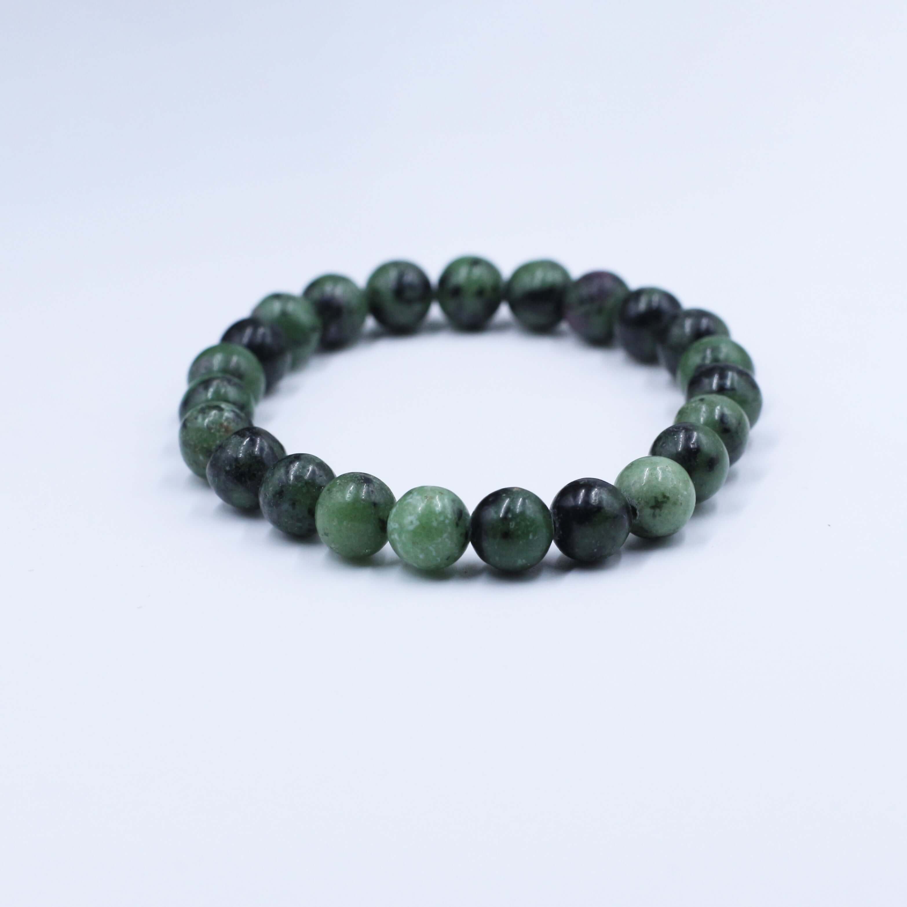 Mysterious Zoisite Bracelet with deep red-green beads for spiritual insight and wisdom.