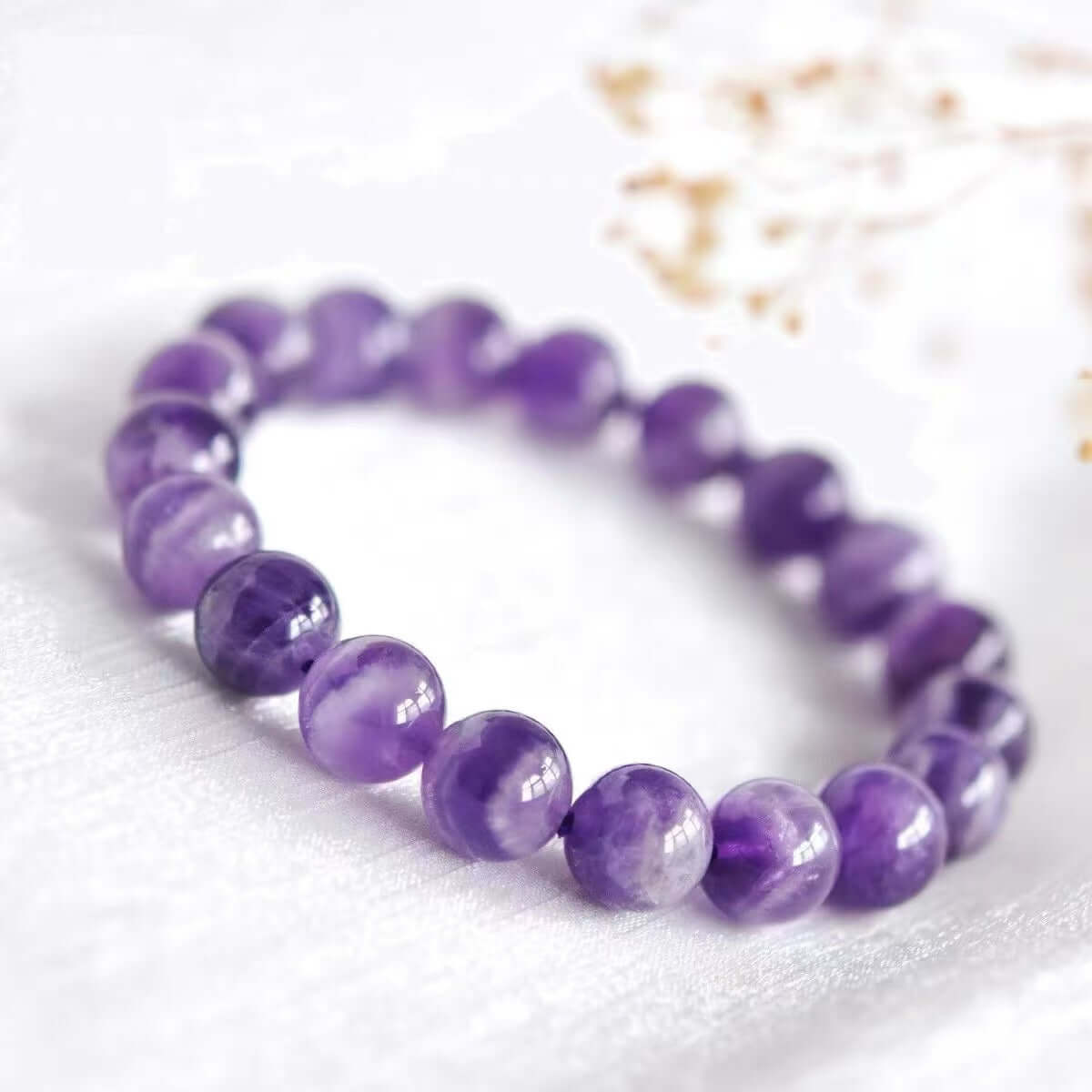 Dreamy Amethyst Bracelet - Wisdom, spiritual crystal jewelry promoting creativity and enlightenment on white background.