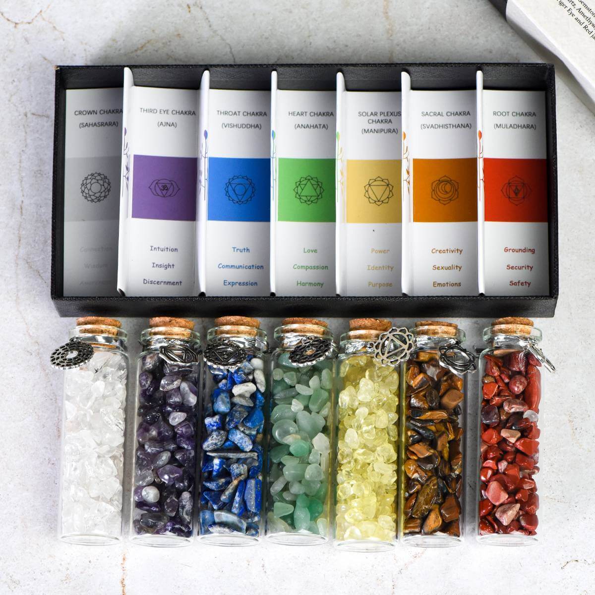 7 Chakra Wish Bottle Set with vibrant gemstones for spiritual healing and chakra alignment, promoting inner exploration and balance.