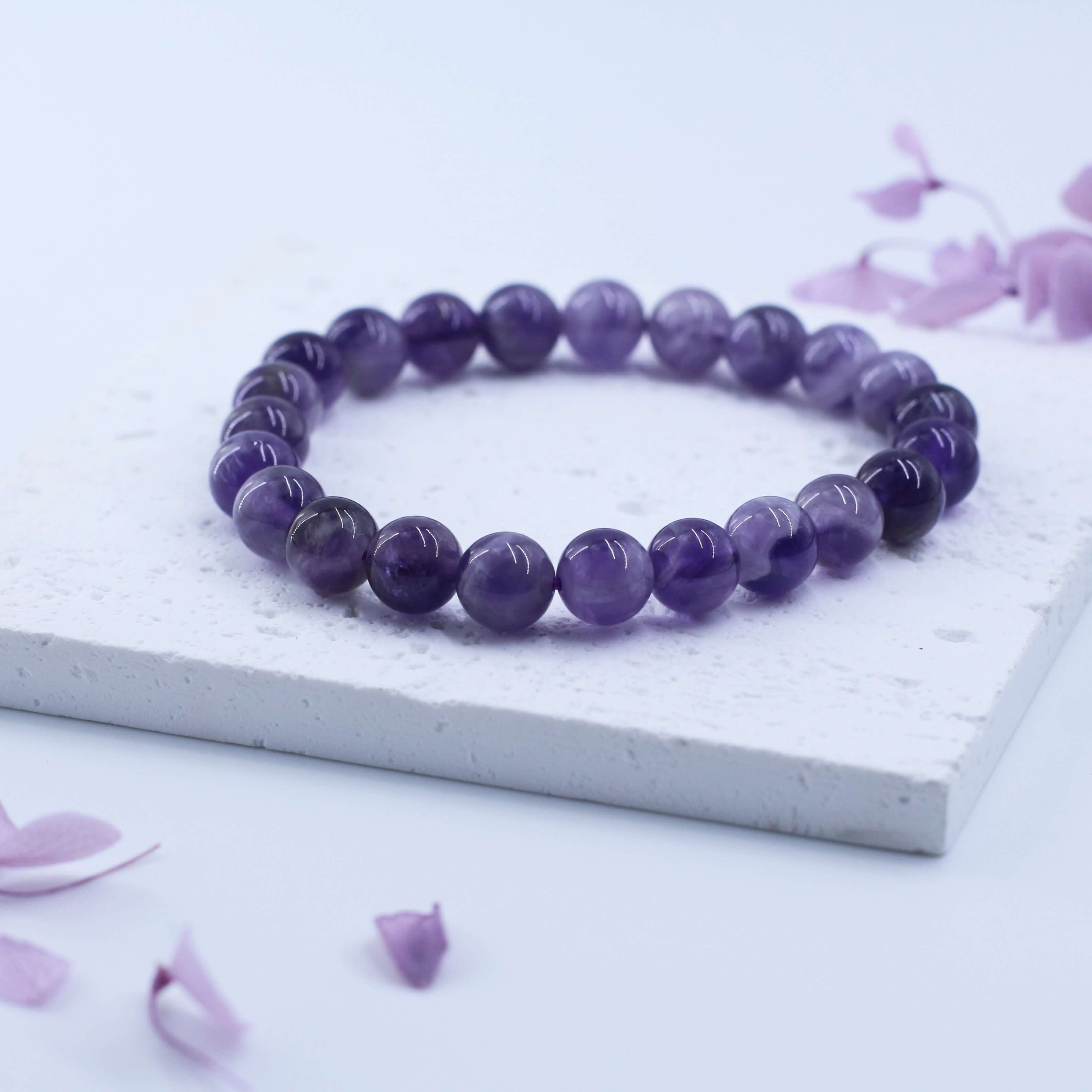 Dreamy Amethyst Bracelet for Wisdom - Enhance spirituality and creativity with this pure crystal wonder on a delicate white surface.