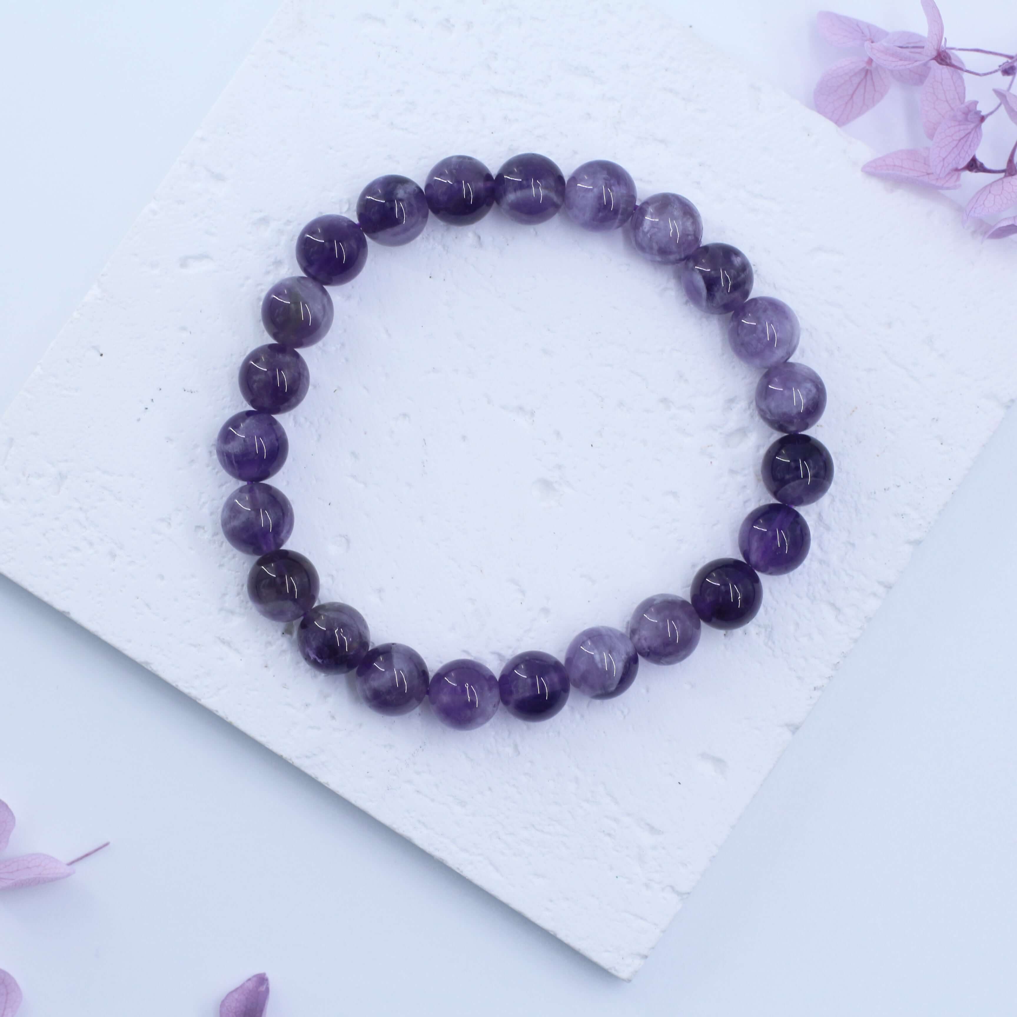 Dreamy Amethyst Bracelet - Wisdom, a spiritual crystal accessory for creativity and positive energy, displayed on a white surface.