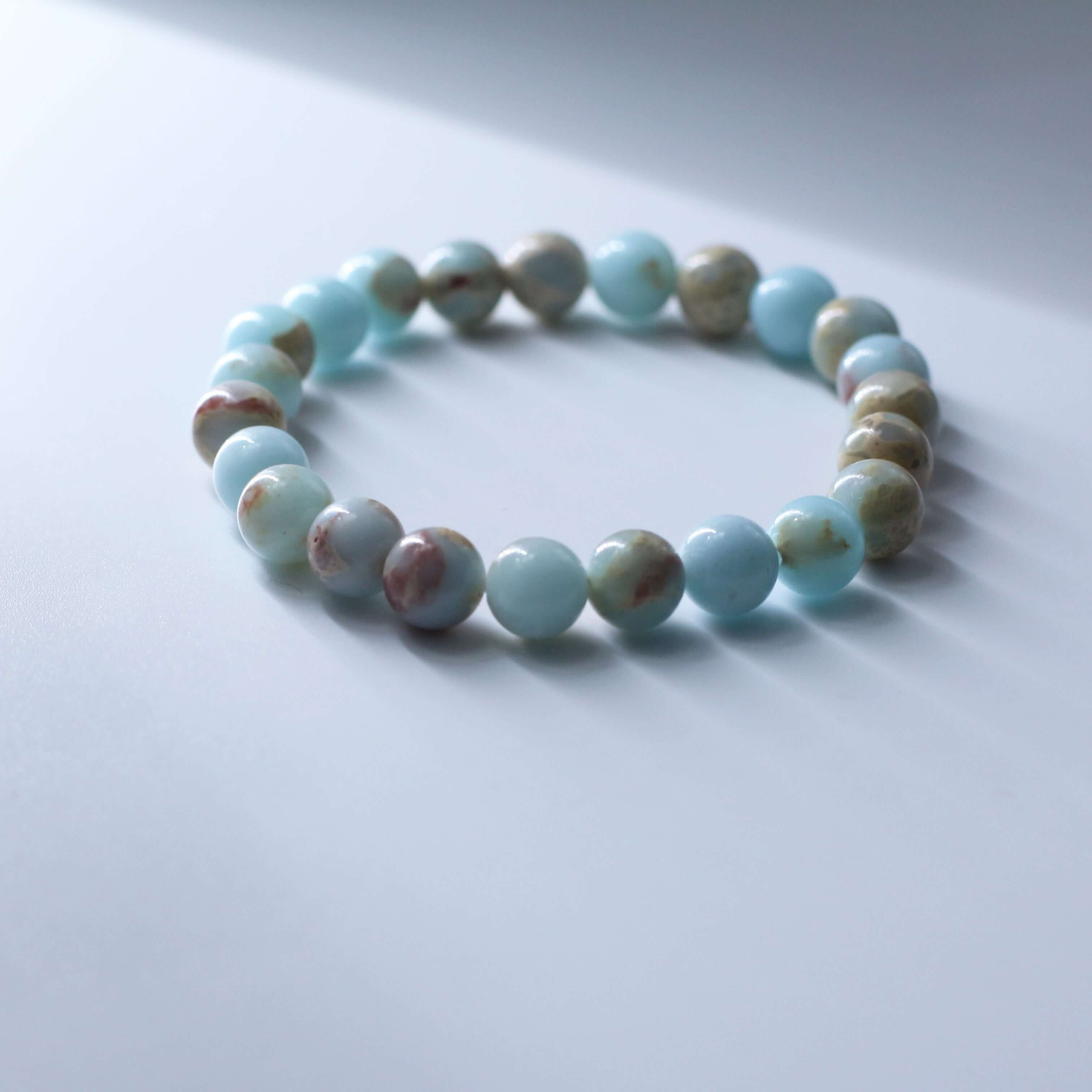 Charming Shoushan Stone Bracelet on white surface, symbolizing auspiciousness and beauty in life.