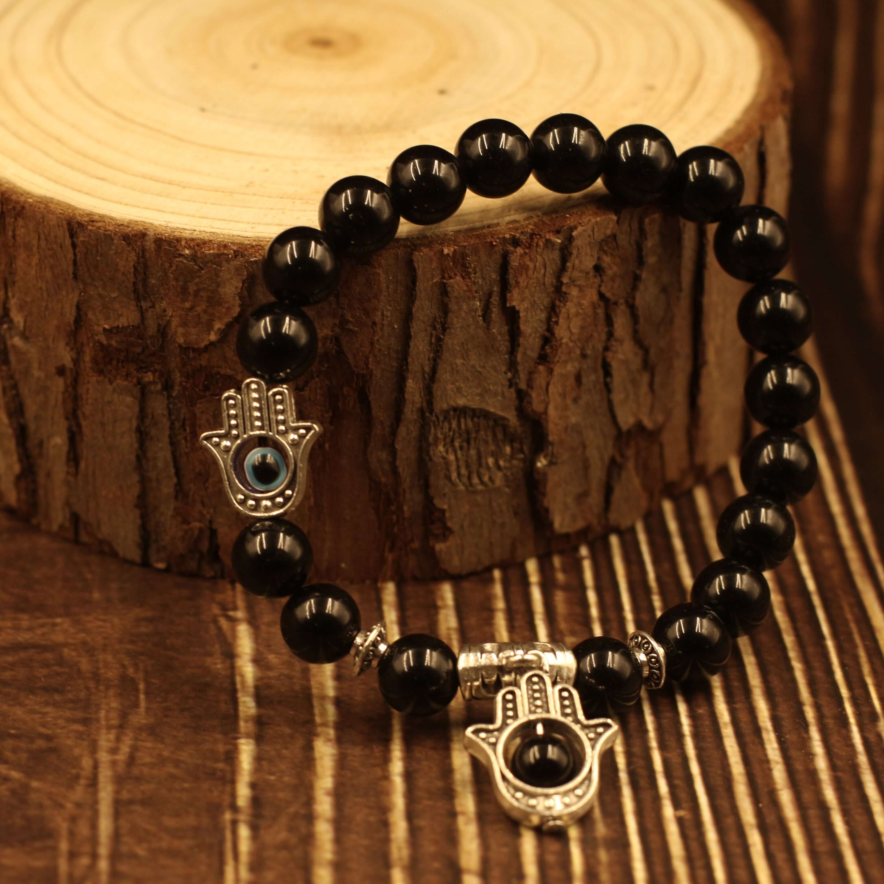 The Eye of Horus Bracelet-Health & Insight on wooden background.