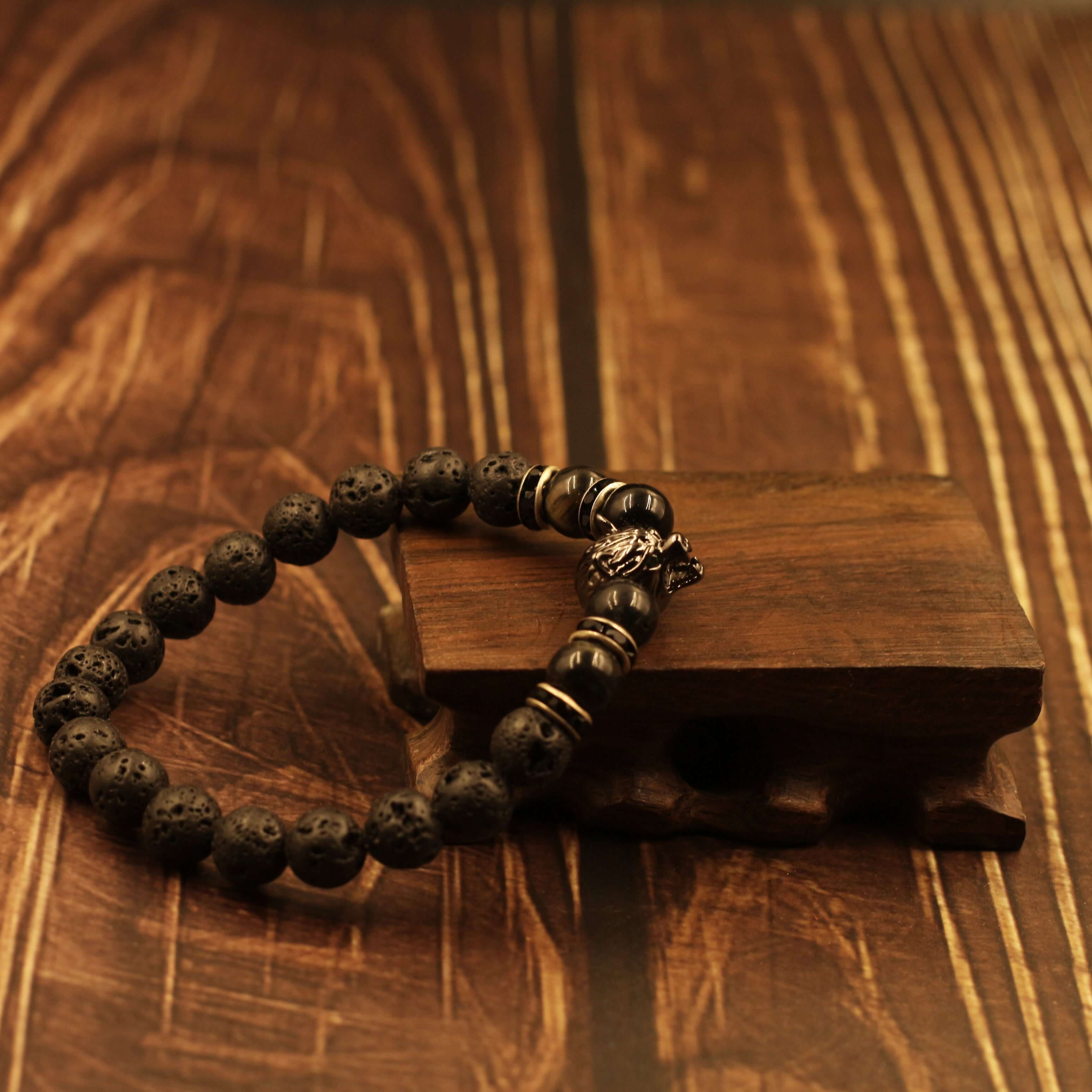 Vintage Wolf-Head Bracelet-Courage & Wisdom, featuring lifelike wolf head and black beads on wooden background, symbolizing bravery and mysticism