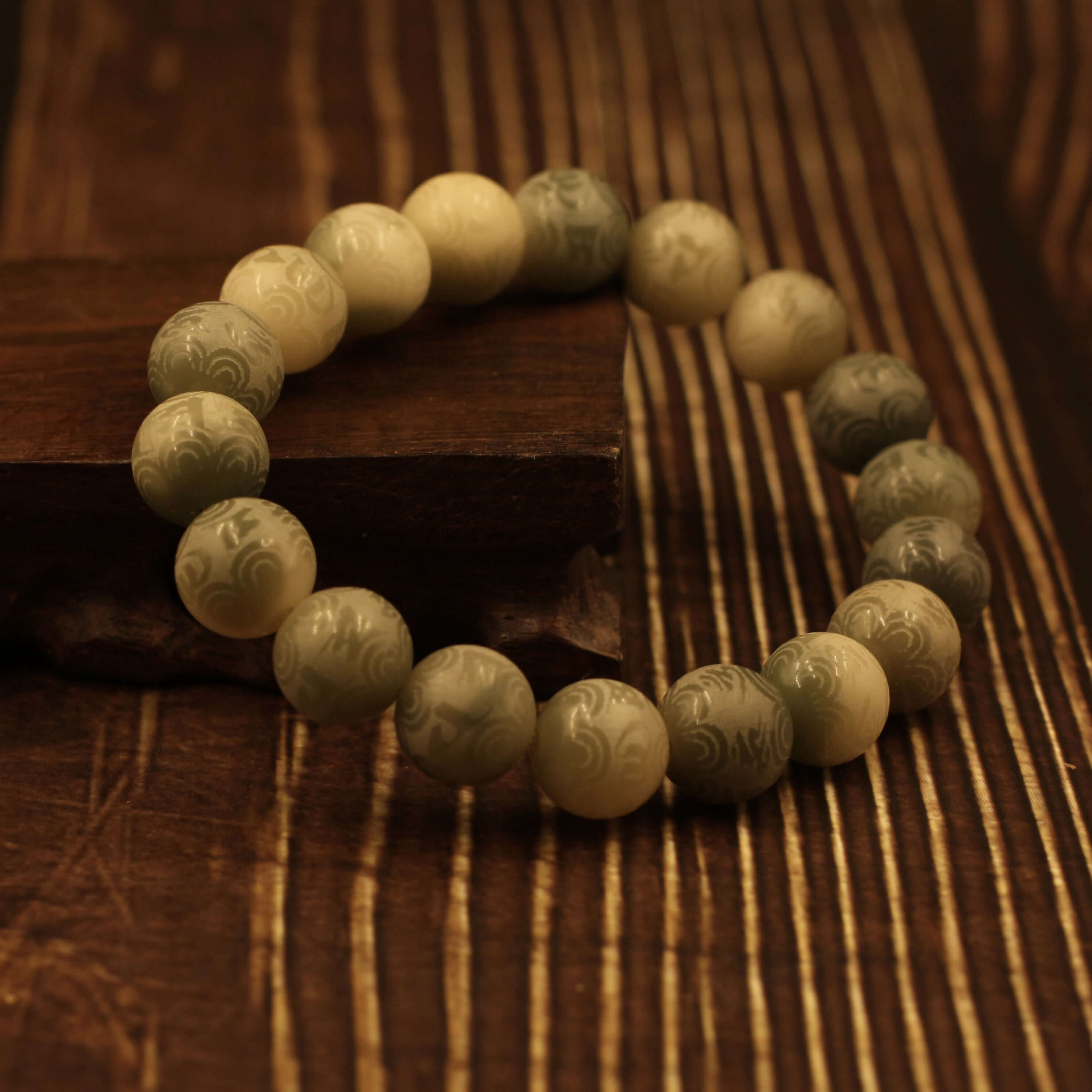 Mani Mantra Bracelet on wooden surface - Strengthen Spiritual Power