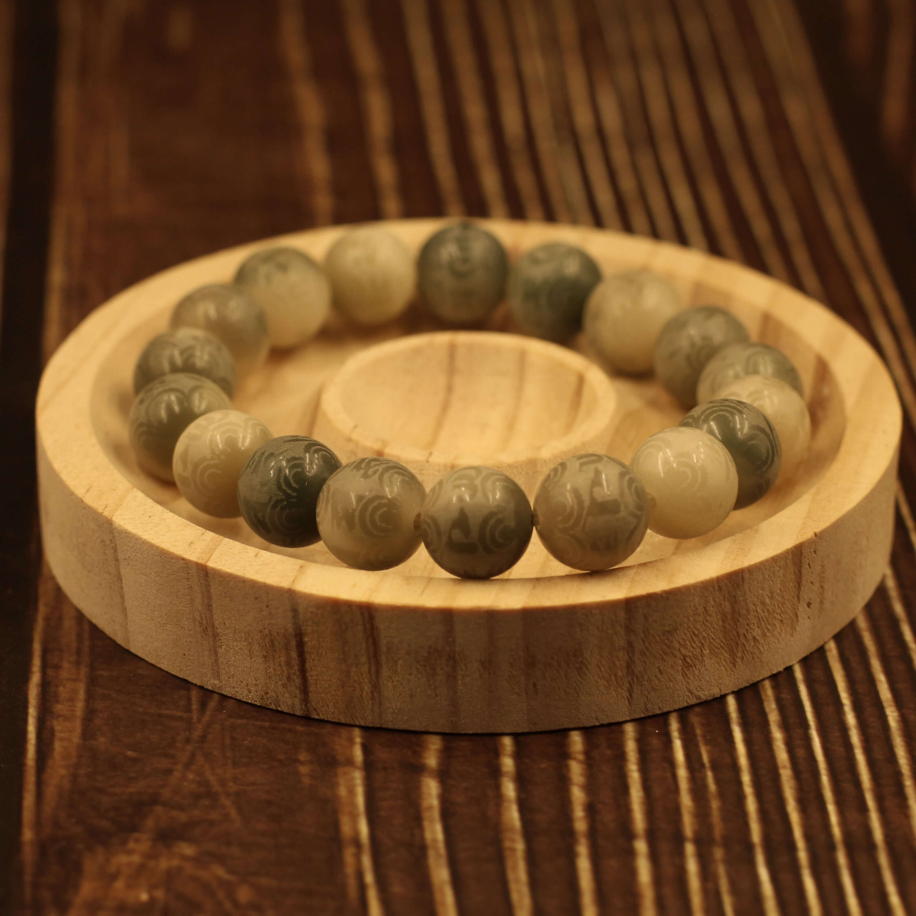 Mani Mantra Bracelet - Strengthen Spiritual Power, Buddhist prayer beads on wooden platform, spiritual empowerment accessory