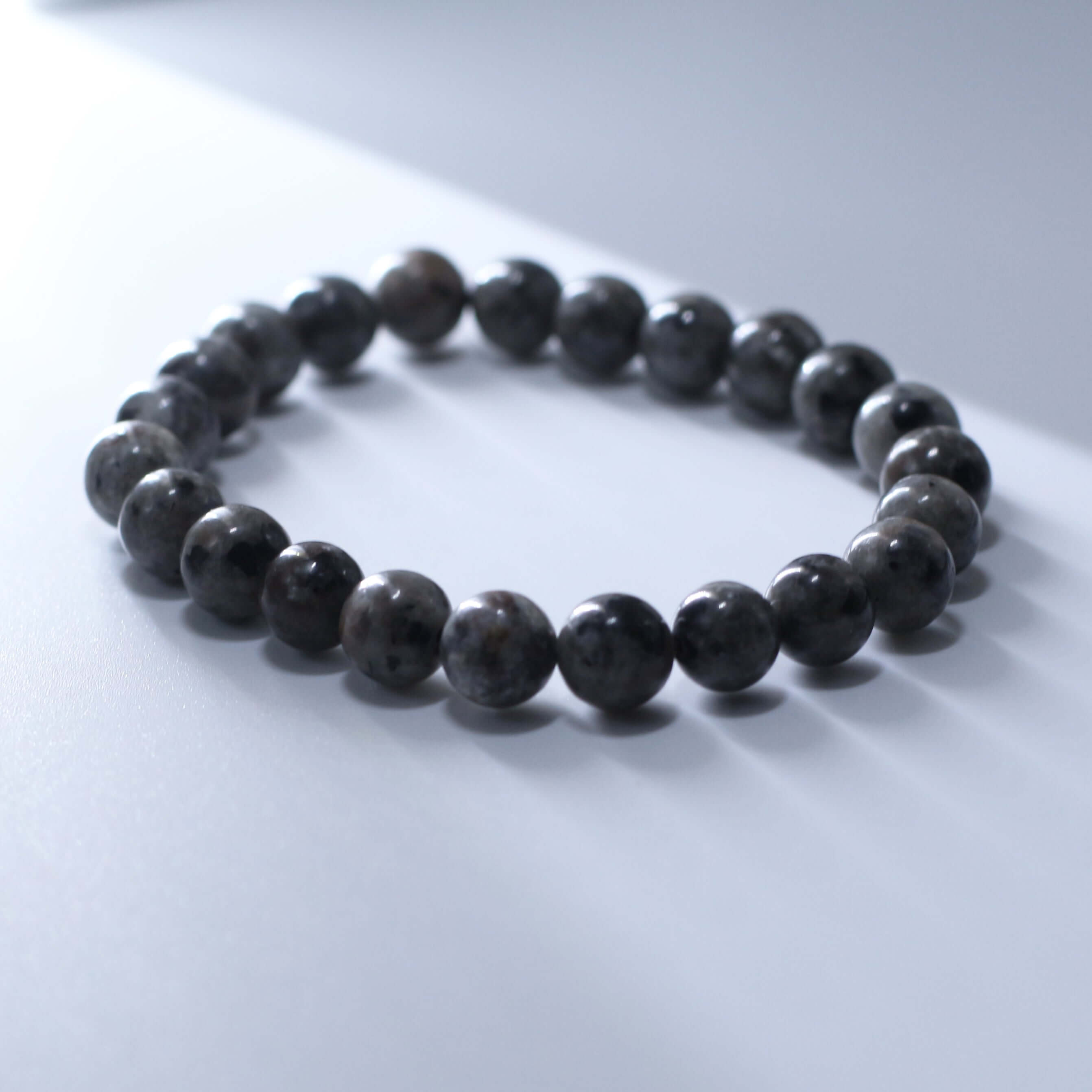 Unique Lava Stone Bracelet for energy and spiritual balance on a white background.