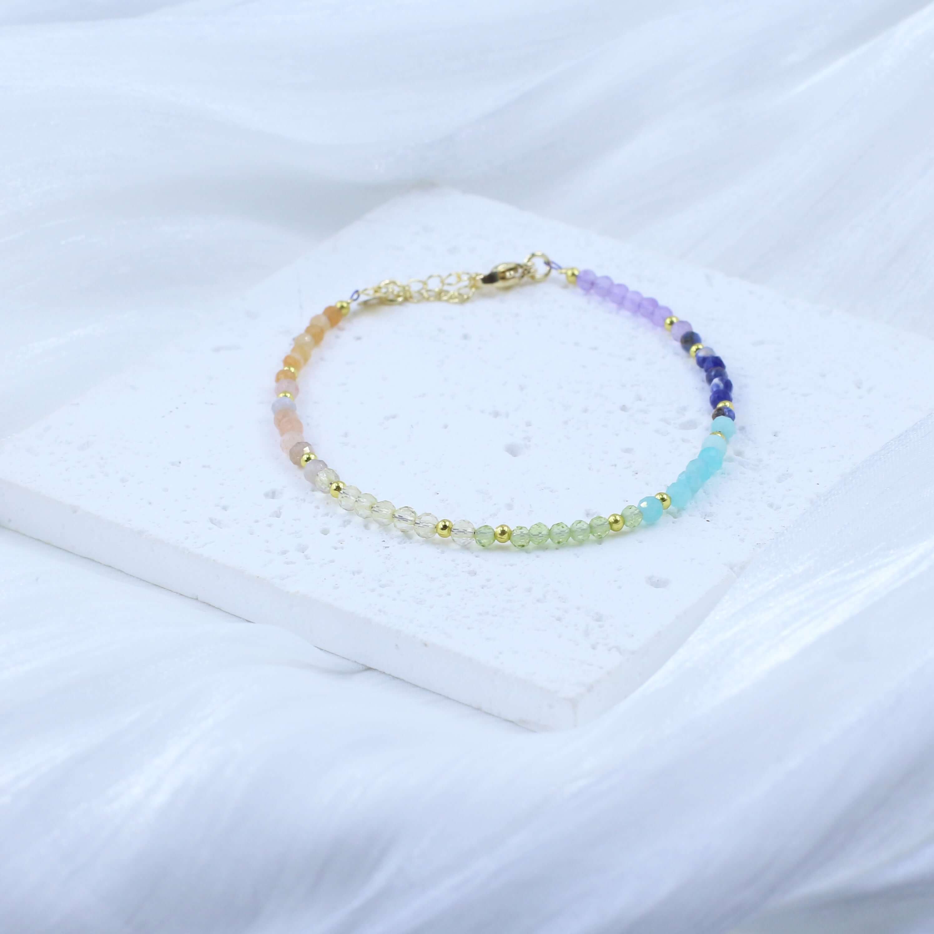 Colorful 7 Chakra Crystal Bracelet for energy balance and inspiration on white background.